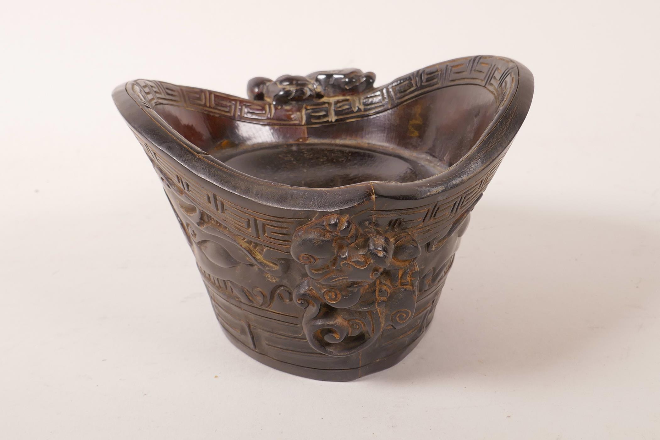 A Chinese faux horn libation cup with carved stylised decoration, impressed mark to base, 4½" x 5½" - Image 2 of 4
