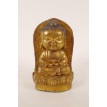 A Chinese bronzed metal Buddha head with gilt patina, 6 character mark verso, 6" high