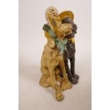 A cold painted bronze figurine of two dogs, in the style of Franz Bergman, 6" high