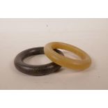 A pair of Chinese faux horn bangles, 3½" diameter