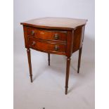 A mahogany shaped top table with two drawers, inset tooled leather top and fluted tapering supports,