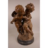 A terracotta sculpture of two cherubs, in the style of Auguste Moreau (French, 1834-1917), signed to
