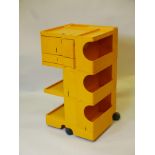 A Joe Colombo Boby trolley, yellow storage unit with three drawers, Italian, 1970s, 28" high x 15"