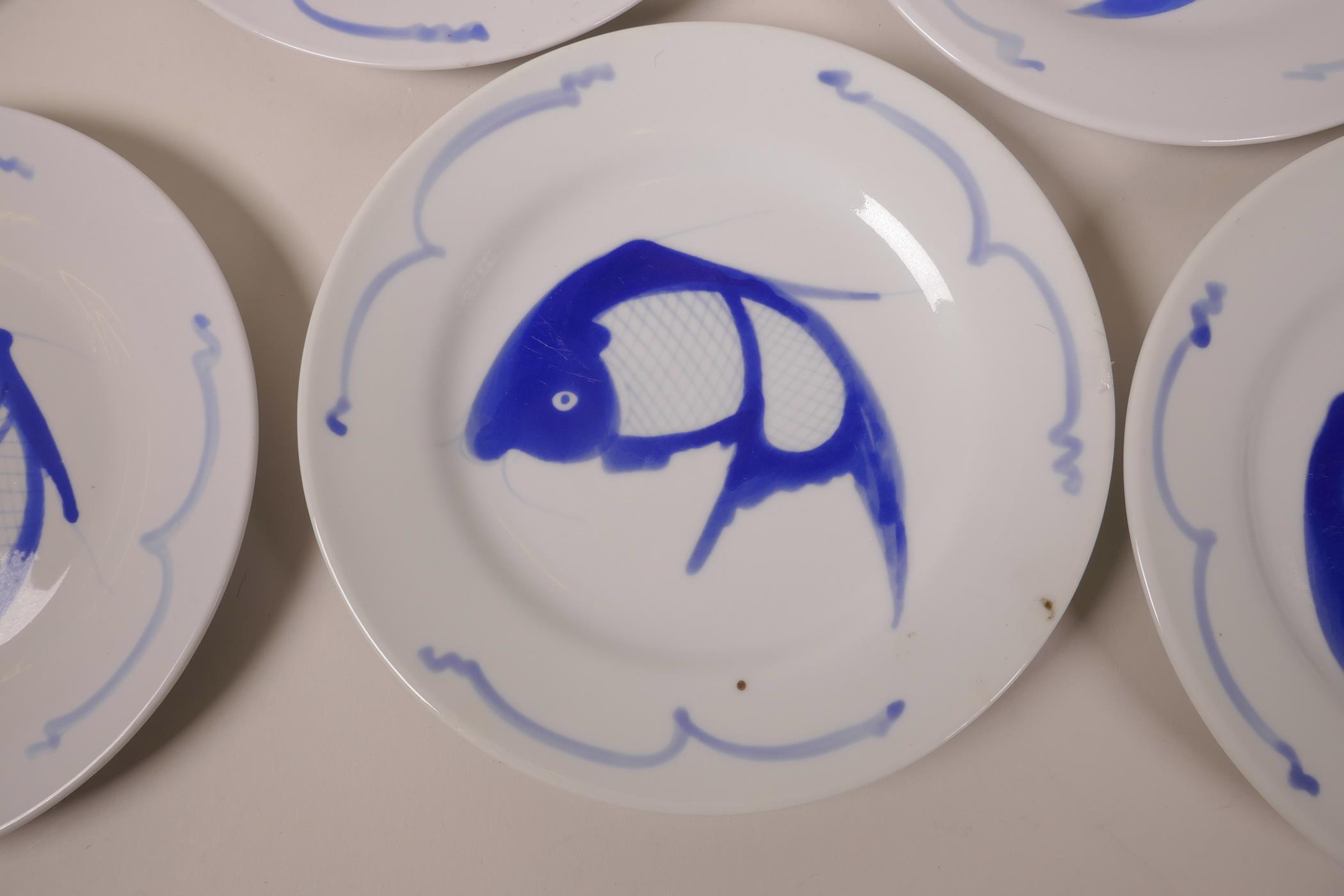 A set of eight Oriental blue and white porcelain side plates decorated with fish, 8" diameter - Image 2 of 3