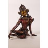 An Eastern red patinated bronze figure of Buddha seated, 9" high