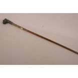 A ladies' walking stick with metal banded cane shaft and bronze handle in the form of a boxer dog'
