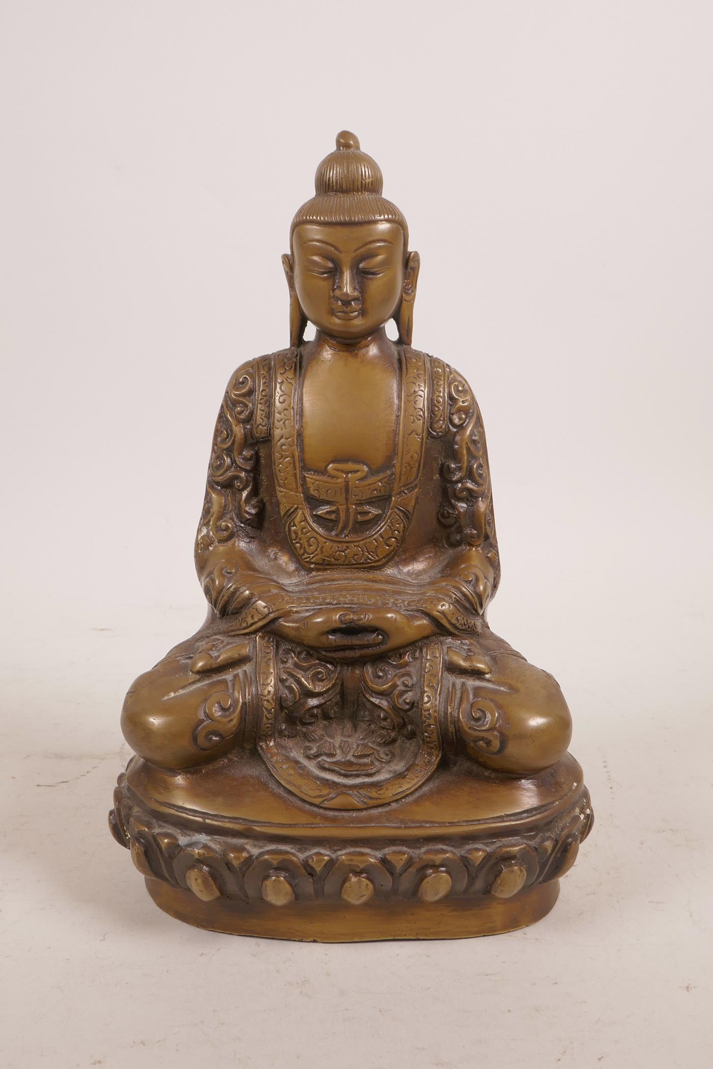 A bronzed metal figure of Buddha, possibly Burmese, 8" high