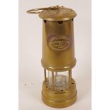 A brass miner's lamp by the Lamp Limelight Company of Hockley Colliery number 8721, serial number