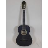 A Sheffield matte black acoustic guitar, 39½" long