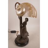 An Art Nouveau style bronze and nautilus shell figural lamp, modelled in the form of a Dutch girl in