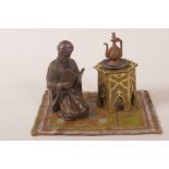 A cold painted bronze inkwell in the form of a Moorish scholar, 3½" high
