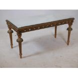 A giltwood and composition occasional table with inset bevelled mirror glass top, 38" x 19" x 19"