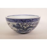 A large Chinese blue and white pottery bowl with dragon decoration, 6 character mark to bowl, 10½"