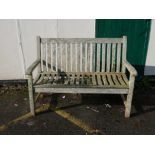 A Westminster teak garden bench with slatted back and seat, 48" long