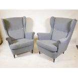 A pair of Ikea 'Strandmon' wing back armchairs, upholstered in 'Nordvalla dark grey', 41" high