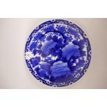An Oriental blue and white decorative plate, with red seal imprinted to base, 12" diameter