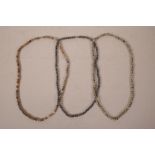 Three strings of hardstone beads, 22" long