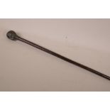 A bamboo walking stick with bronze handle cast as a skull, 36" long