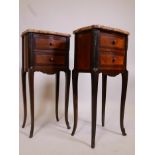 A pair of inlaid mahogany and brass mounted bedside chests, with marble tops and two drawers, raised