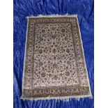 An ivory ground Kashmir rug with all over floral design, 46" x 67"