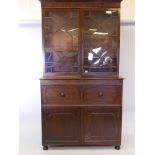 A C19th mahogany secretaire bookcase in the style of Gillow, with astragal glazed top over a