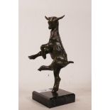 A bronze figure of a leaping nanny goat, mounted on a stone base, 8" high
