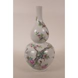 A Chinese double gourd porcelain vase with polychrome enamel decoration of a fruiting peach tree and