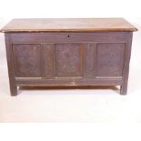 A C19th oak three panel coffer with carved decoration, 27" high x 50" wide x 23" deep