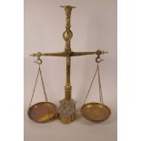A set of Portuguese 'Bull's Head' brass balance scales with set of metric weights fitted to the