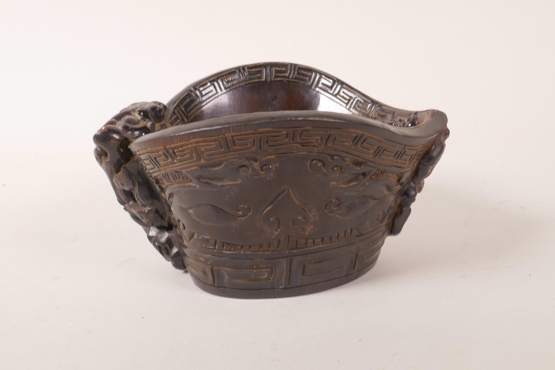 A Chinese faux horn libation cup with carved stylised decoration, impressed mark to base, 4½" x 5½" - Image 3 of 4