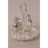 A novelty silver plated egg cruet comprising tray, two egg cups and salt and pepper pots formed as