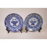 A pair of Chinese blue and white porcelain dishes with lobed rims and floral decoration, on a