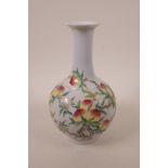 A Chinese polychrome enamelled porcelain bottle vase decorated with a fruiting peach tree, seal mark