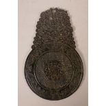 A large Chinese spinach hardstone tablet with carved and pierced decoration of dragons on a pi-disc,