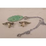 A faux jade (glass) pendant on plated chain, cracked, together with a pair of silver,