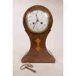 A French c.1910 balloon mantel clock in mahogany, with satinwood inlay, 4½" white enamel dial and
