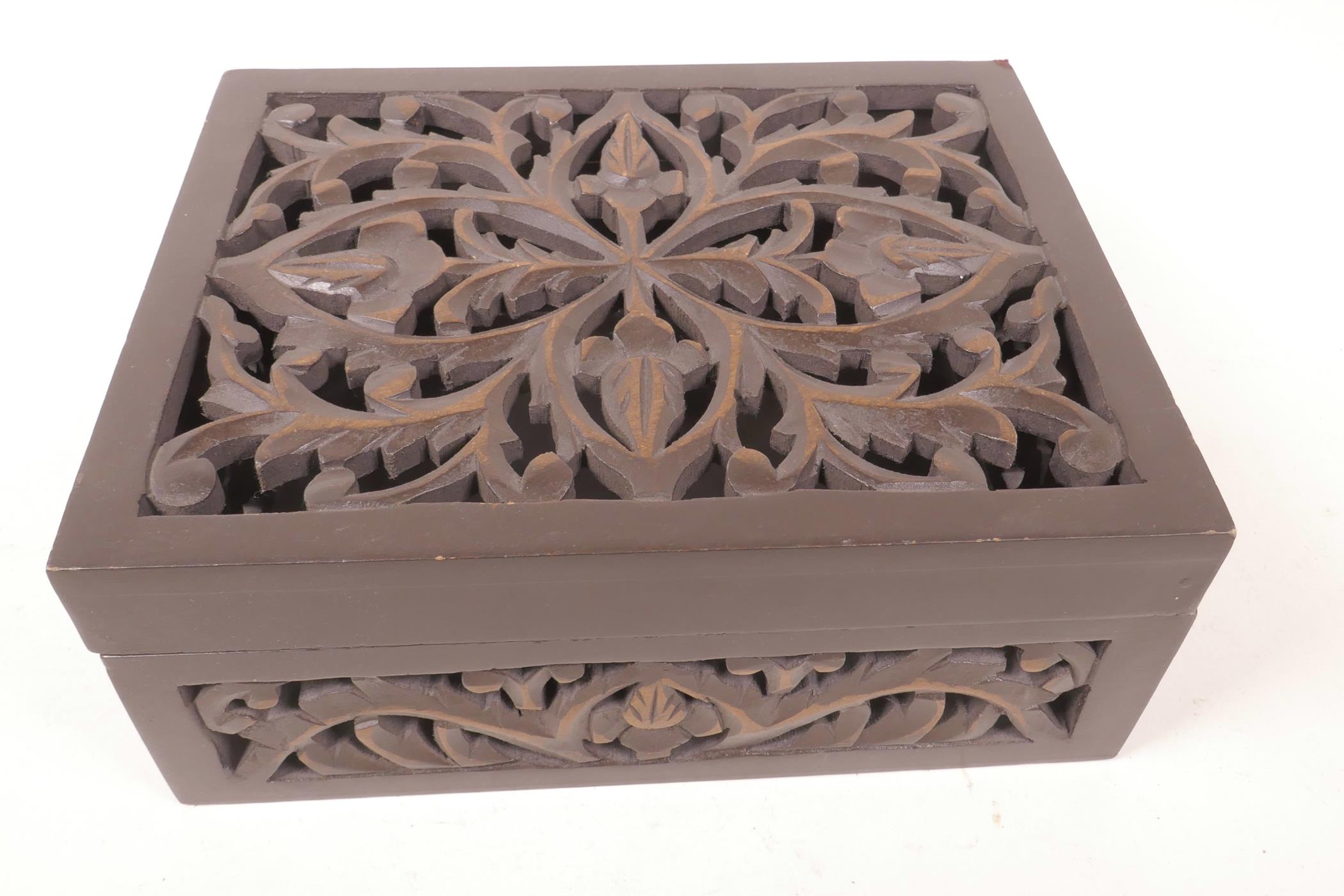 A pierced and carved wood box, 10" x 8" x 4"