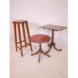 A Georgian mahogany tilt top occasional table, raised on a turned column and splay supports with