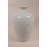 A late C19th/early C20th Chinese celadon glazed porcelain meiping vase with raised scrolling lotus