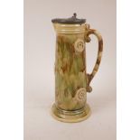 A majolica jug with pewter lid, 11½" high