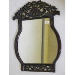 A Chinese pagoda shaped, carved hardwood frame wall mirror, with pierced decoration of bamboo and