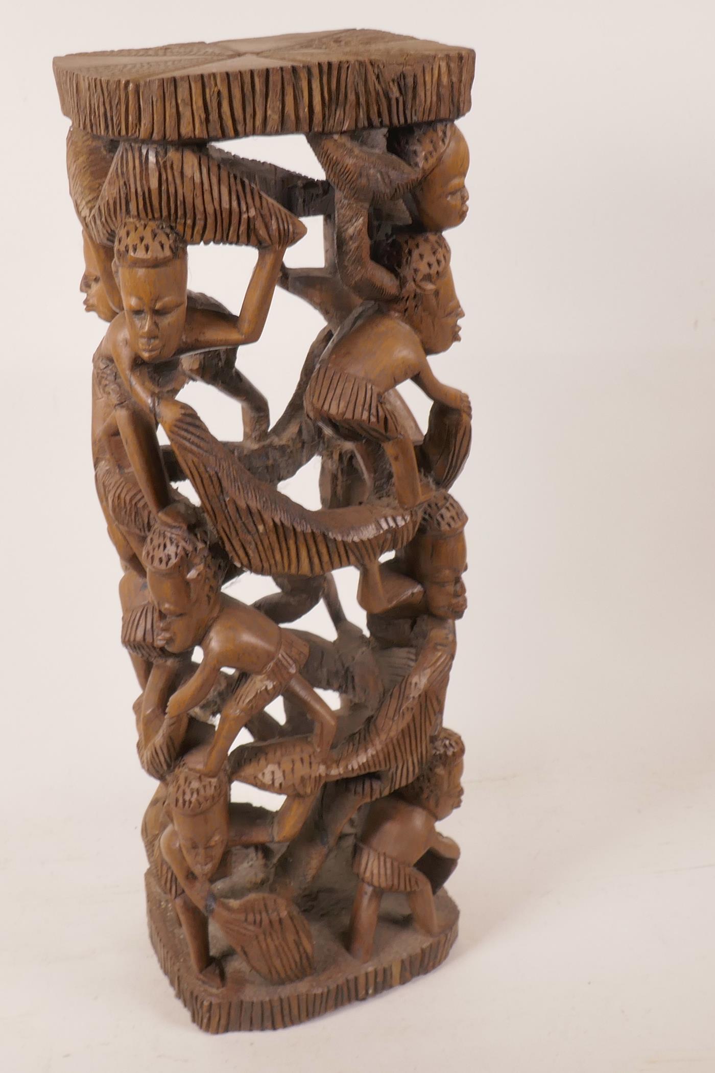 An African hardwood lamp base carved as a tower of figures, 18½" high - Image 2 of 2