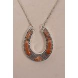 A sterling silver and agate set horseshoe pendant necklace, pendant 1" wide