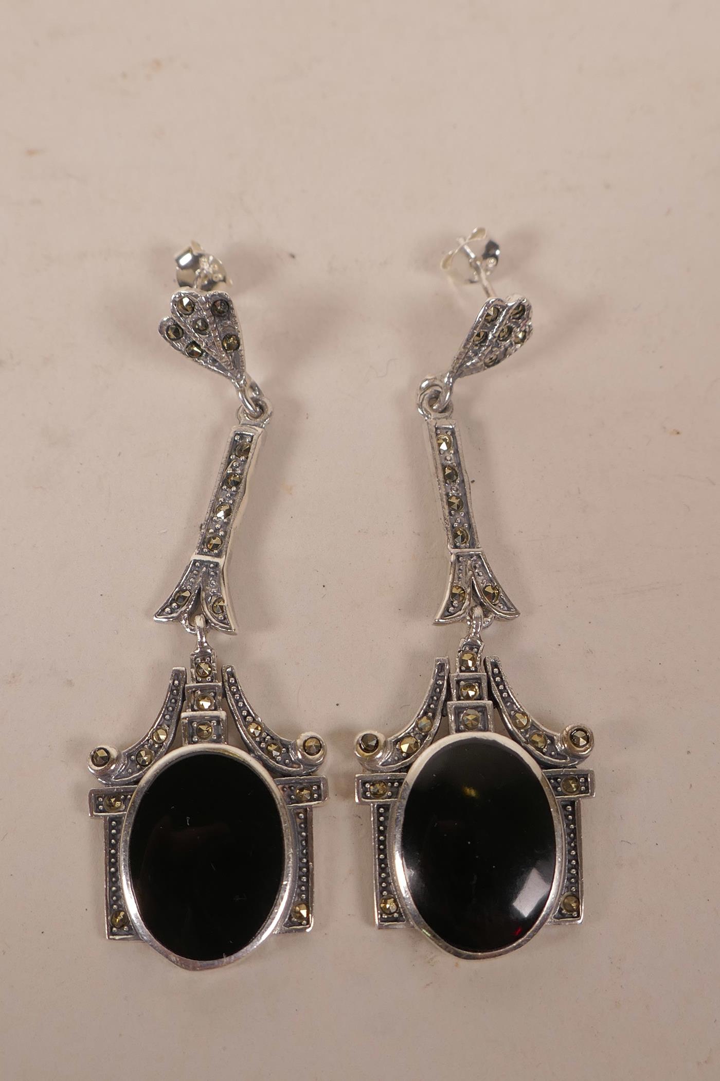 A pair of silver, enamel and marcasite set Art Deco style earrings, 2" long