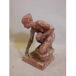 A terracotta figure of a female nude with a frog, indistinctly signed, 12½" x 12½" x 23" high