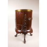 An C18/C19th mahogany wine cooler with brass mounts and handles, and small drawer to base, on four