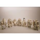 A set of seven Japanese large okimono figures, bone work intricately incised with polychrome
