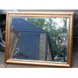 A gilt framed bevelled glass wall mirror, 47" x 37" overall