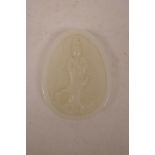 A Chinese carved jade pendant decorated with Quan Yin, 2½" x 3"