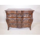 An oak shaped front three drawer commode with carved decoration, 39" x 19½" x 31½" high